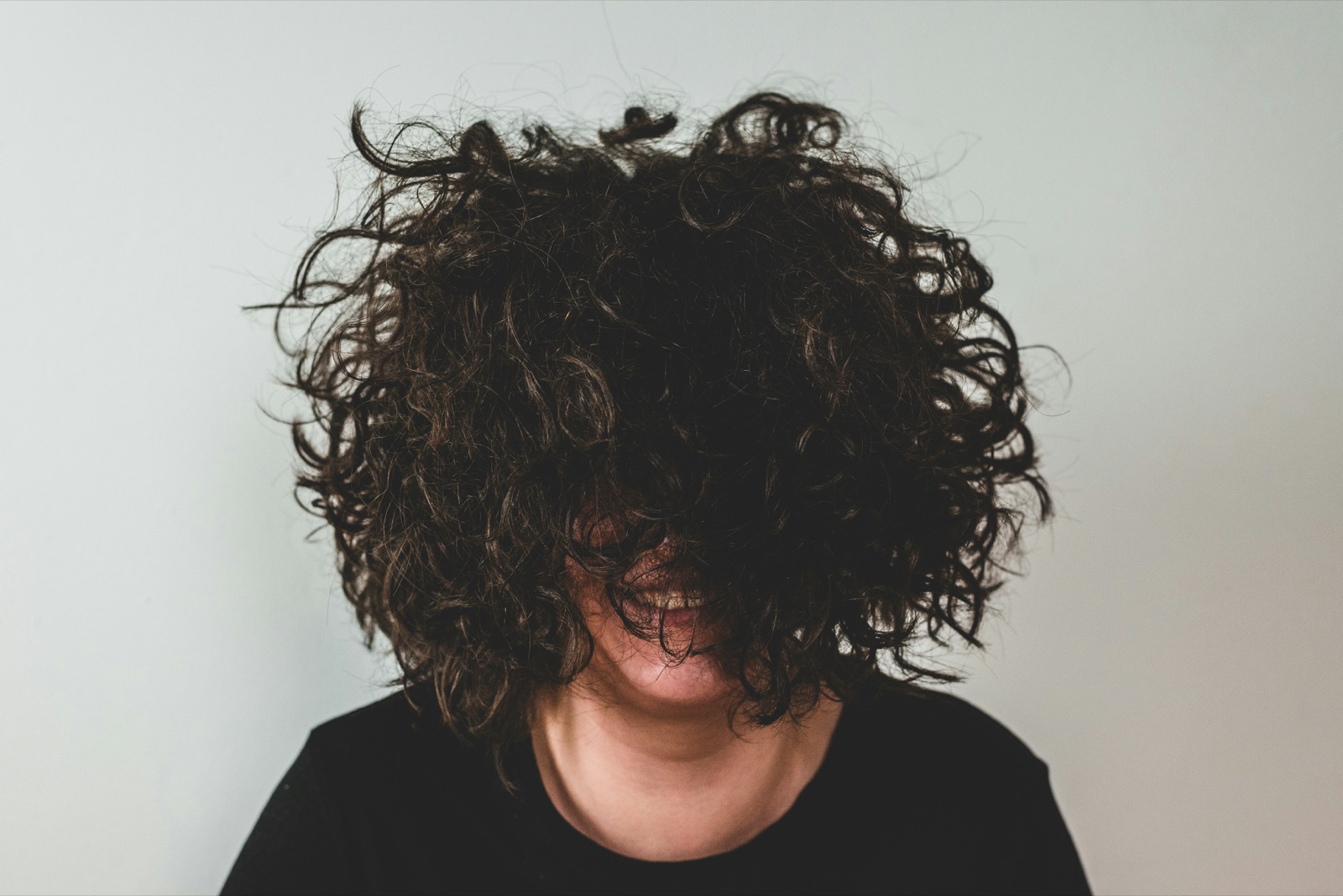 Woman with voluminous, healthy curly hair