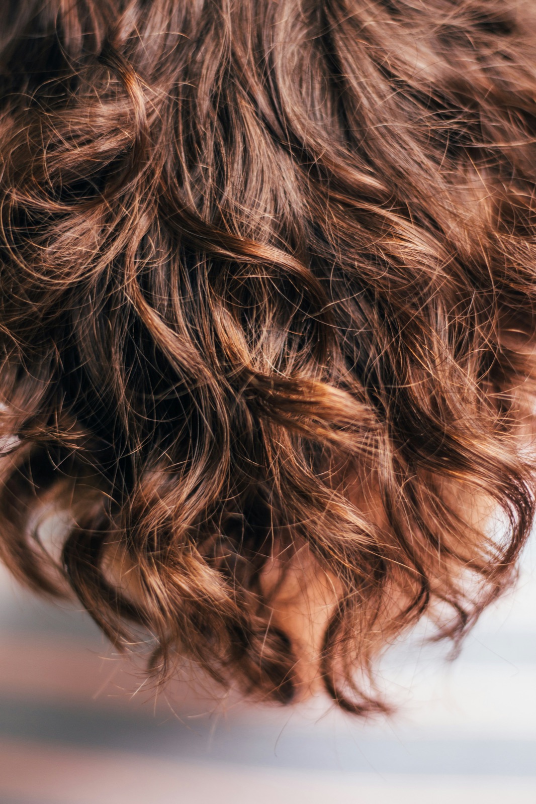 Close-up detail of healthy permed curl texture